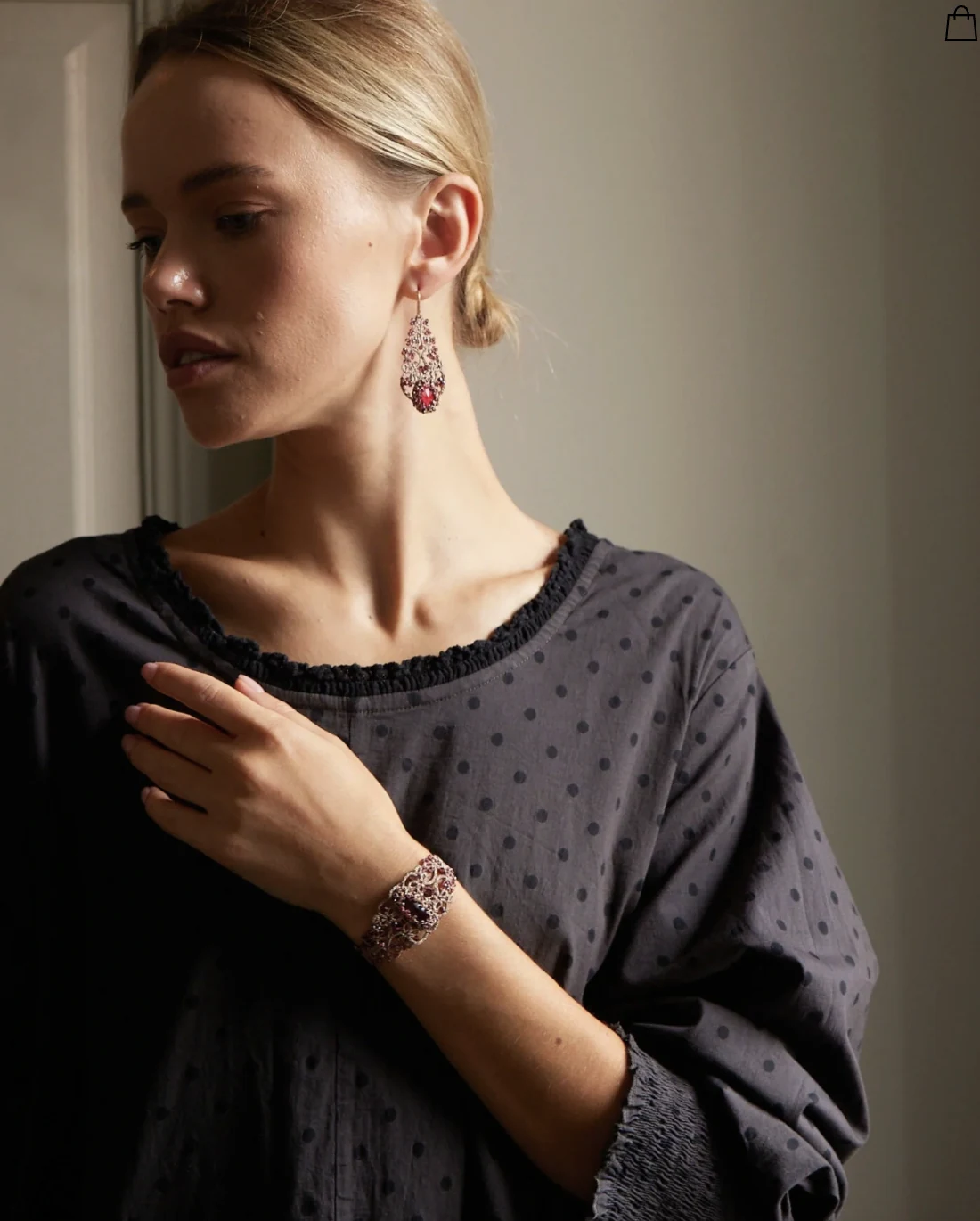 Lorina Balteanu earrings and bracelet worn by a model